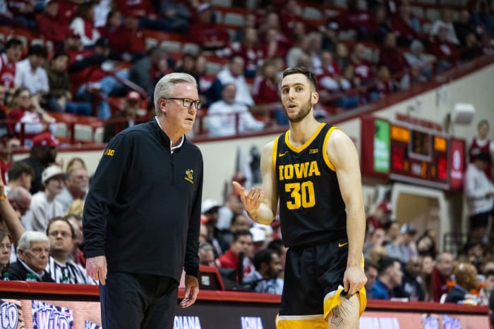 Iowa Hawkeyes head coach Fran McCaffery and guard Connor McCaffery (30) in the second half against the Indiana Hoosiers.